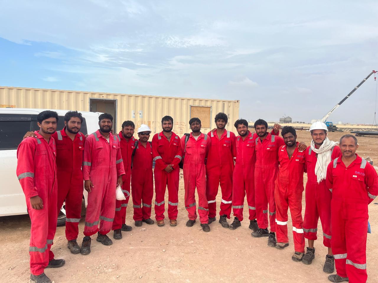 Pramuk marine response team in safety coveralls at a work site